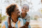 Father and child hug - visual concept for family law blog for divorced parents.