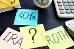 401k ira roth on pieces of paper. Visual concept for legal blog discussing how retirement accounts are dividing in a divorce