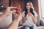 Boyfriend proposing to girlfriend engagement ring. Visual concept for a blog covering things to discuss before marriage.